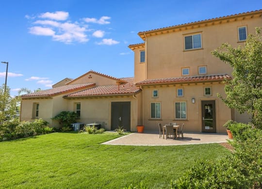 a backyard with a lawn at Ventana Senior Apartments, California