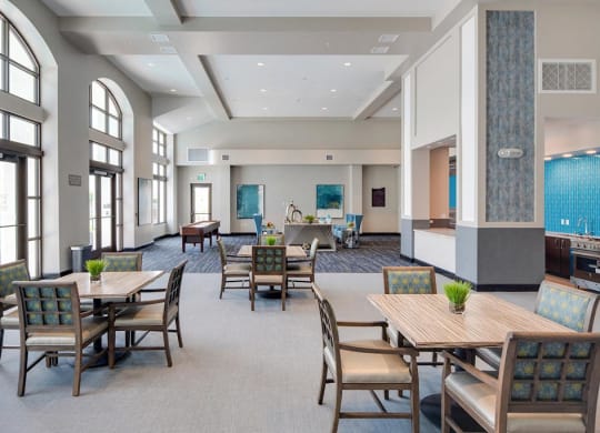 a large community room with tables and chairs and games at Deer Creek Apartments, San Ramon, 94582