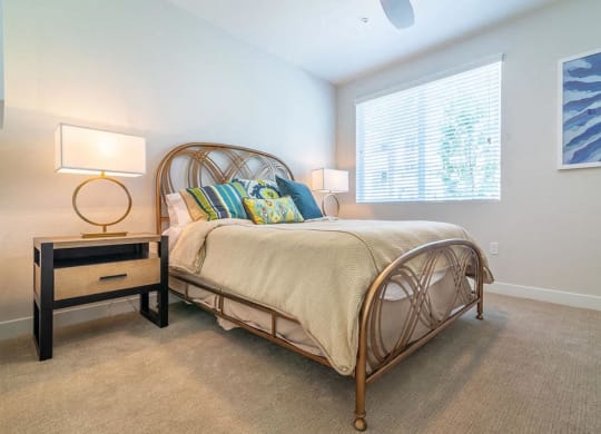 Bedroom with bed at Montecito Apartments at Carlsbad, California