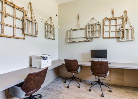 an office with two chairs and a computer at The Vineyards Apartments, Porter Ranch, CA