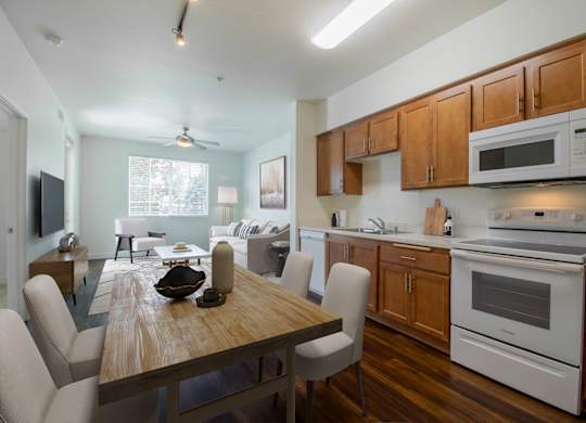 Kitchen with white appliances at Portola Senior Apartments, Carlsbad, CA, 92010