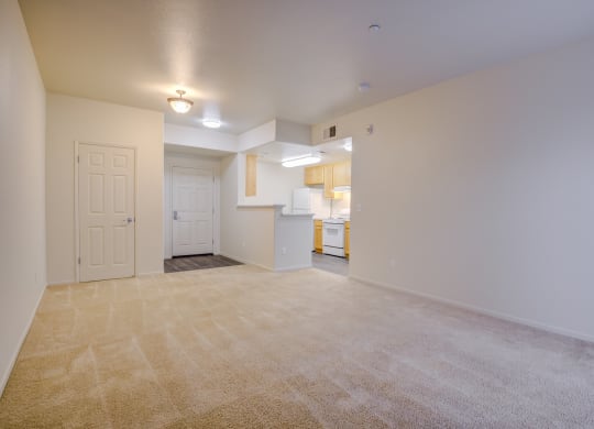 an empty living room with a kitchen in the background  at Seville at Gale Ranch, San Ramon