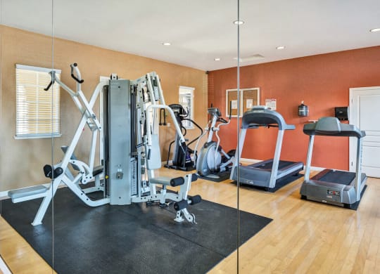 a home gym with a treadmill and weights  at Falcon Bridge at Gale Ranch, San Ramon