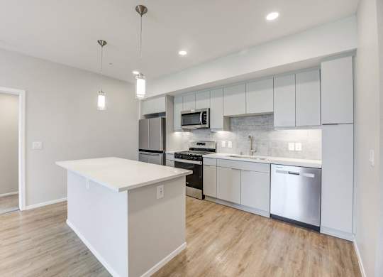 Kitchen with stainless steel appliances and island at The Overlook Santa Clarita, CA 91350