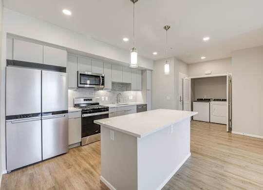 Kitchen with stainless steel appliances with full washer dryer at The Overlook Santa Clarita, CA 91350
