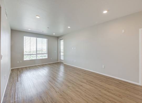 a bedroom with hardwood floors and grey walls at The Overlook Santa Clarita, CA 91350