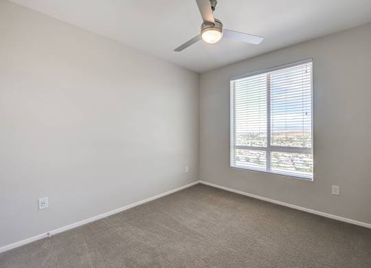 Secondary bedroom with ceiling fan at The Overlook Santa Clarita, CA 91350