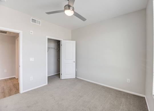 a bedroom with gray walls and a ceiling fan at The Overlook Santa Clarita, CA 91350