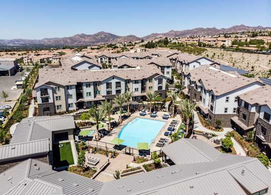 an aerial view of a resort style community at The Vineyards Apartments, Porter Ranch, CA