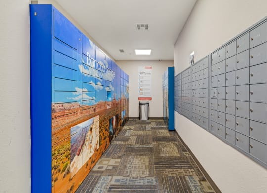 a hallway with lockers and a mural on the wall at Rancho Serene, Las Vegas, NV