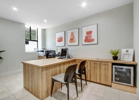 a room with a desk and two chairs at The Kenmore Los Feliz, California