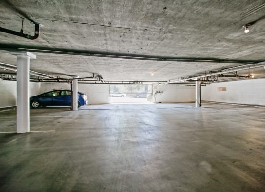 a large parking garage with a car in it at Palm Capri Apartments, California