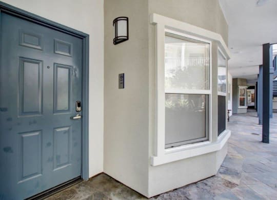 a blue door with a window next to it at Toluca Court, Toluca Lake