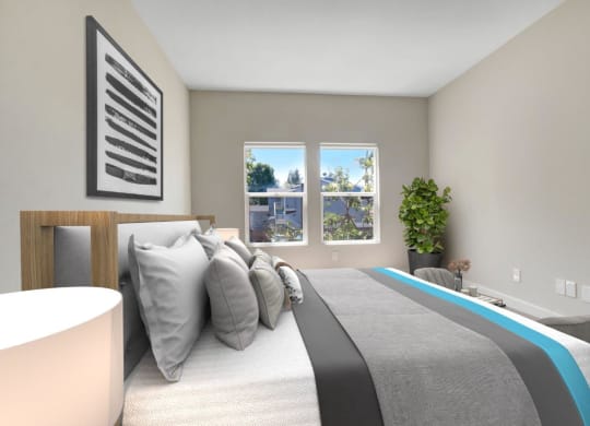 a bedroom with a bed and two windows at Toluca Court, Toluca Lake