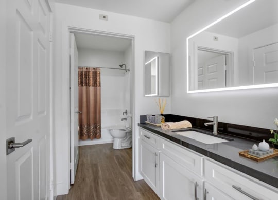 a bathroom with a sink and a toilet at Toluca Court, Toluca Lake, CA