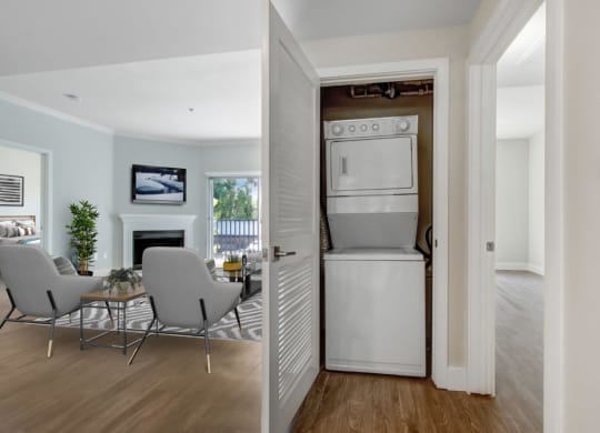 a white washer and dryer in a room with a table and chairs at Toluca Court, Toluca Lake, California