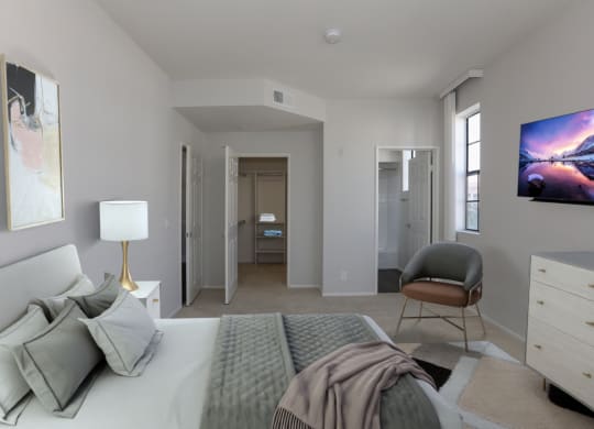 a bedroom with a bed and a chair and a closet at Burton, Los Angeles, CA, 90048