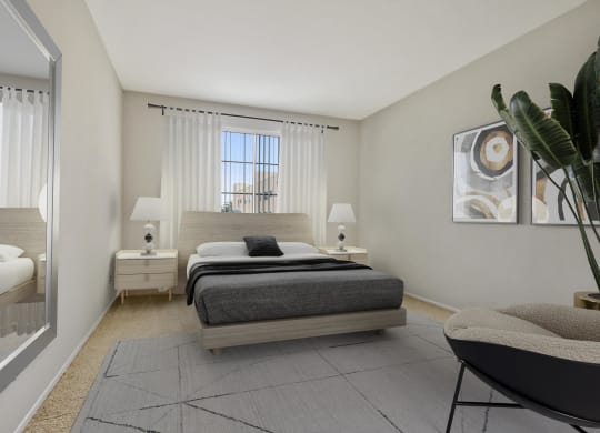 a bedroom with a bed and a mirror and a window at Darlington Apartments, Los Angeles