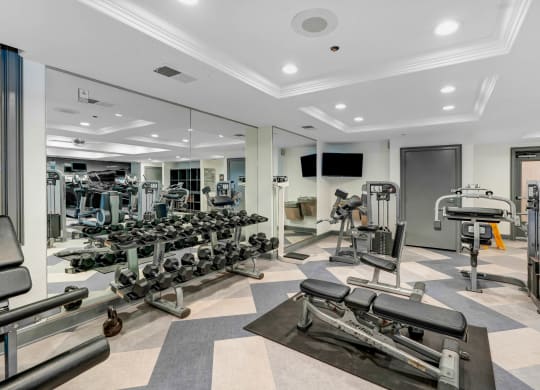 a spacious fitness center with state of the art exercise equipment and mirrors  at Apex Mission Valley, San Diego