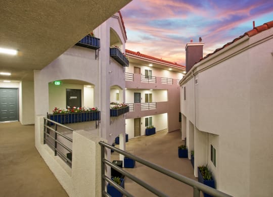 a balcony with a view of a colorful sky at Alon Apartments, Los Angeles, CA