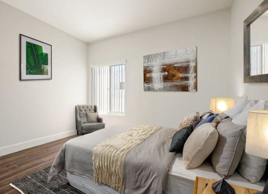 a bedroom with a bed and a chair and a window at Atrium, Los Angeles, California