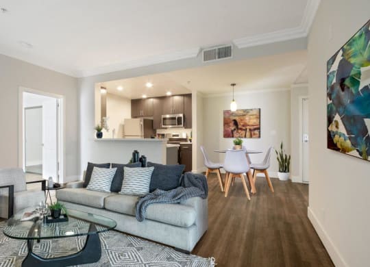 a living room with a couch and a table with chairs at Atrium, Los Angeles, CA, 90024