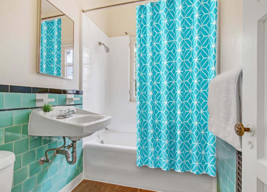 a bathroom with a sink and a bathtub  at 1022 Tiverton, Los Angeles, 90024