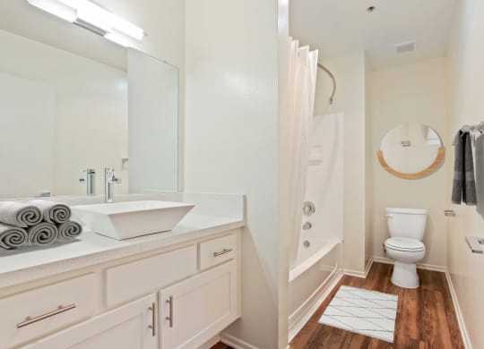 a bathroom with a sink and a shower and a toilet at Palm Royale Apartments, Los Angeles, CA