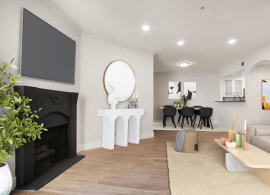 a living room with a fireplace and a tv at Burton, Los Angeles