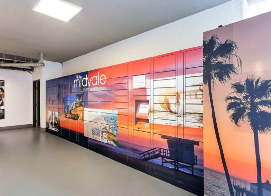 a wall with a mural of a beach and a palm tree