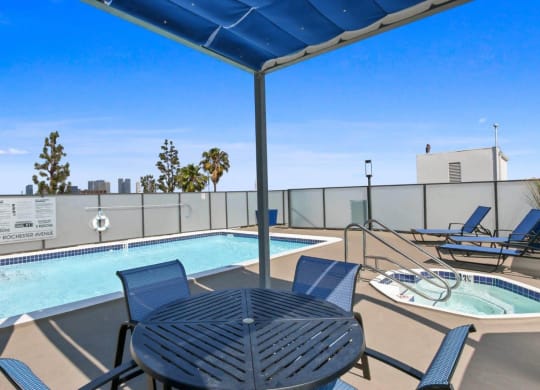 Poolside Dining Table at Rochester Apartments, Los Angeles, CA, 90024