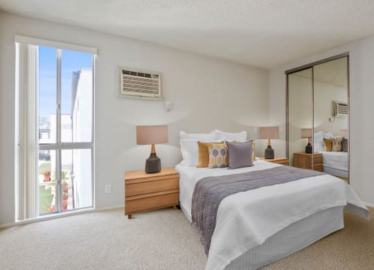 Bedroom white interior with bed at Rose Apartments, Los Angeles, CA, 90034