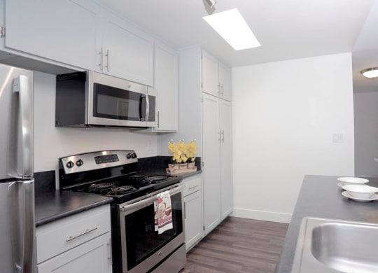 Kitchen area with appliances and cabinets1 at Waverly, California, 90039