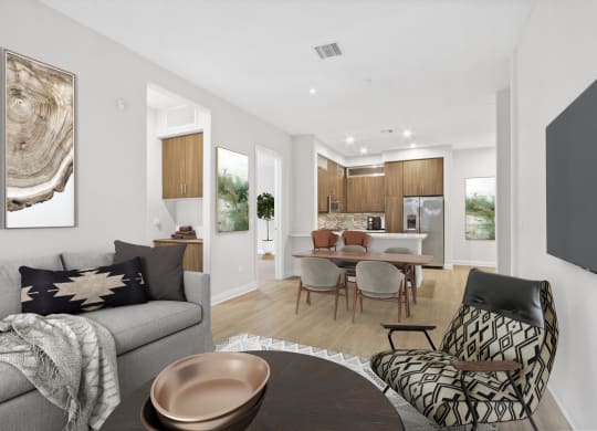 a living room with a couch and a table with chairs at The Adler Apartments, California, 90025