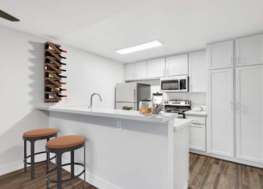 A kitchen with white cabinets and a white counter top at Waverly, Los Angeles, CA