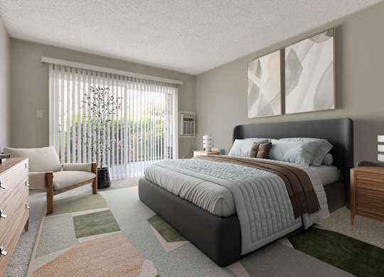 A bedroom with a large bed and a chair by the window at Waverly, Los Angeles, CA