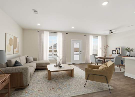 A well-lit living room with a grey sofa, a wooden coffee table, and a yellow armchair.