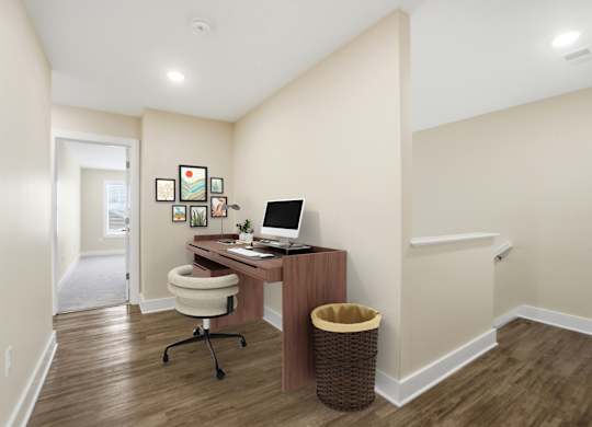 A room with a desk and a chair.