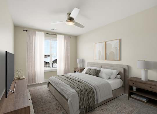 A bedroom with a large bed, a flat screen TV, and a ceiling fan.