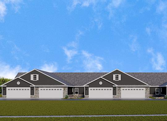 A large house with a grey roof and four garages.