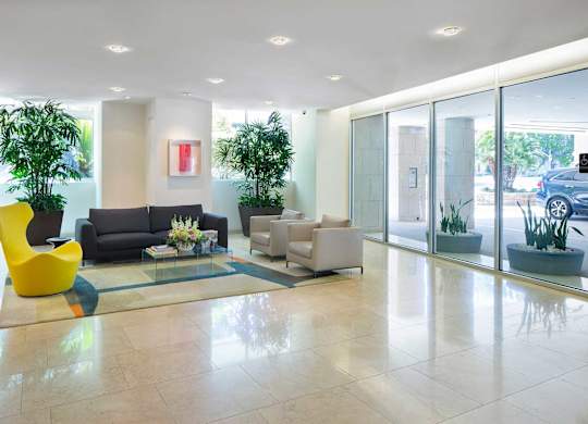 Lobby area with seating at Wilshire Margot, Los Angeles, CA