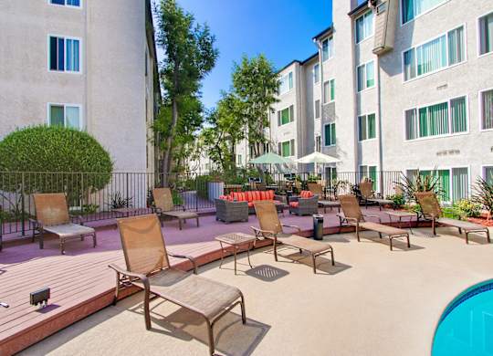Pool lounges at Woodcliff Traditional-Style Apartments for Rent Near Beverly Hills