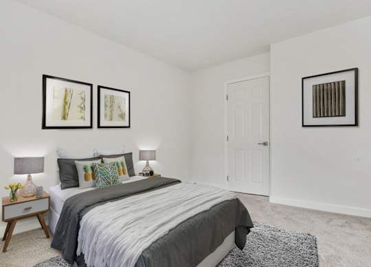 Bedroom with carpet flooring at Woodcliff Remodeled Apartment Rentals Near UCLA