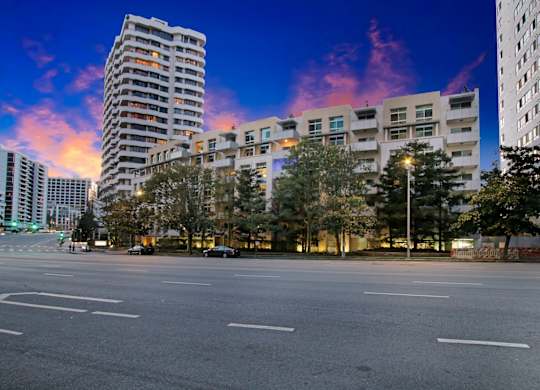 A city street with buildings and a clear sky.at Wilshire Margot, Los Angeles