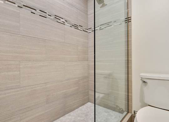 Bathroom with shower stand, glass door