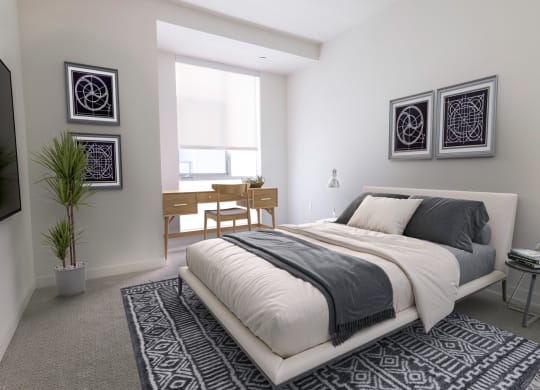 a bedroom with a bed and a desk and a window at Seventh West Apartments, California 