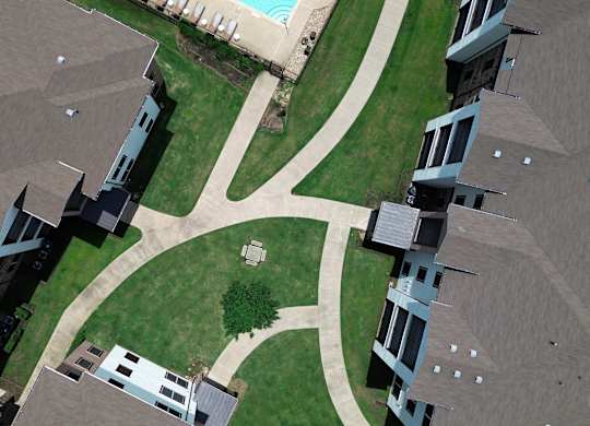A view of a courtyard surrounded by buildings.