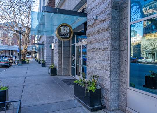 the facade of 18 condos on a city street