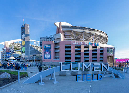 a view of the front financial field in front of a large stadium
