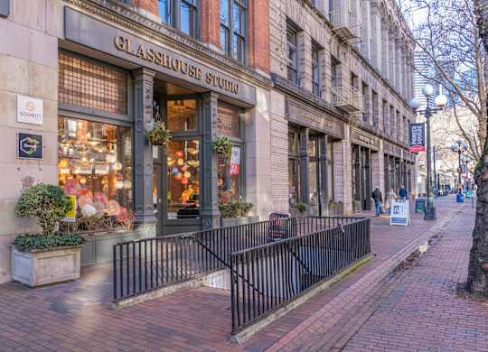 a city street with a gate in front of a building
